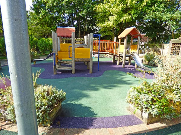 Refurbished adventure play area with colourful climbing towers