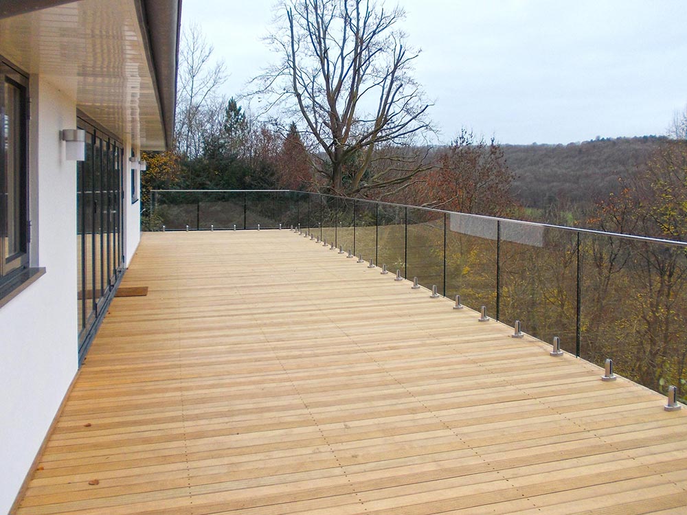 Extensive decking finished with glass walled rails with fabulous view