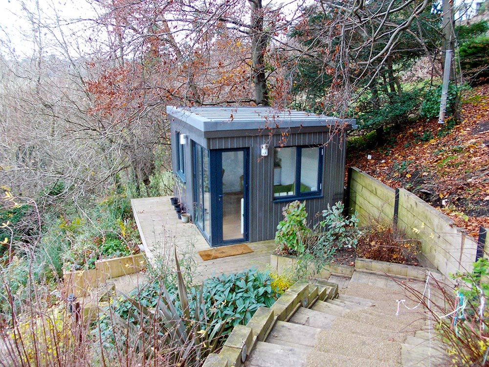 Modern cabin office on hillside down steps from main house