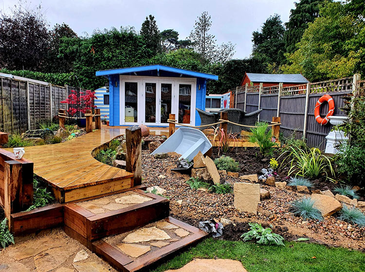 Nautical garden make-over with new paving and decking in a boardwalk style