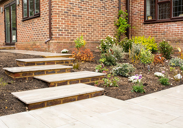 Looking towards new steps at side of house with new planting