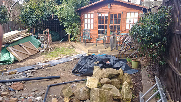 View from patio showing debris left by the builder